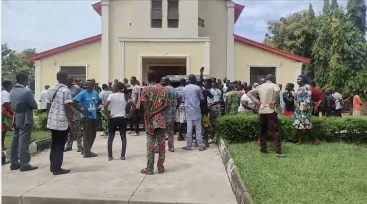 Sympathizers gather outside St. Francis Catholic Church, Owo, Ondo State, after Islamic extremists killed over 40 worshippers on the alter Sunday, June 5, 2022.