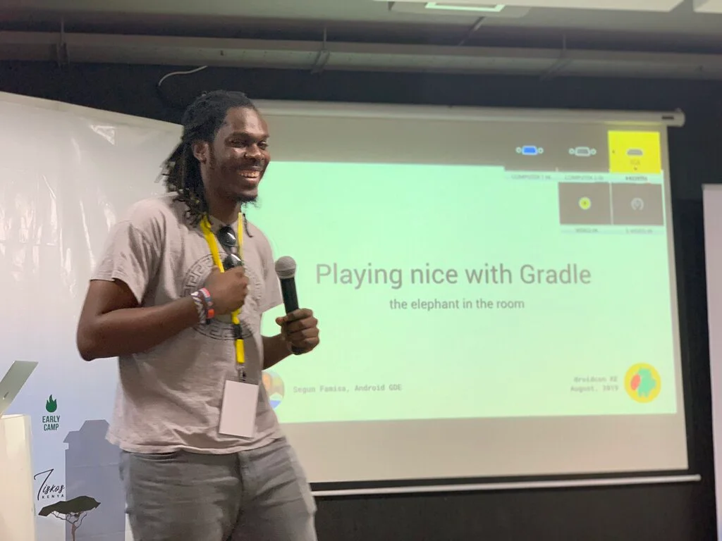 This photo shows Segun Famisa giving lecture on Playing nice with Gradle
